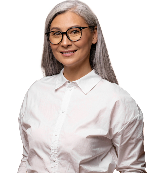 Becoming-an-agile-coach-Hero A professional businessperson in a white button up shirt smiles at the camera in a portrait